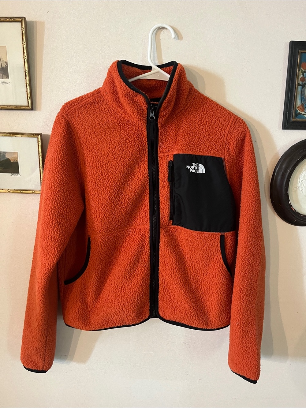 The North Face Orange Sherpa Fleece Jacket with Black Chest Pocket